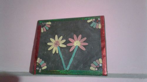 Close-up of flowers on wall at home