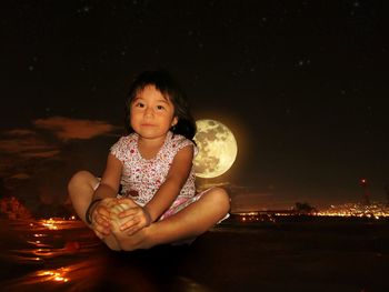 Portrait of a girl sitting at night