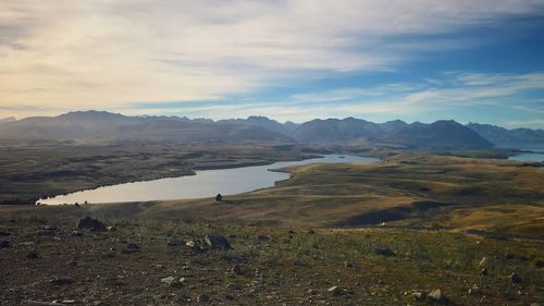 A stunning view of milky-turquoise blue lake tekapo from mount john in new zealand during autumn