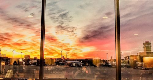 Reflection of sky on glass window during sunset