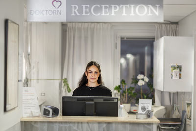 Receptionist looking at camera