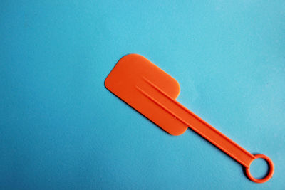 High angle view of red table against blue background