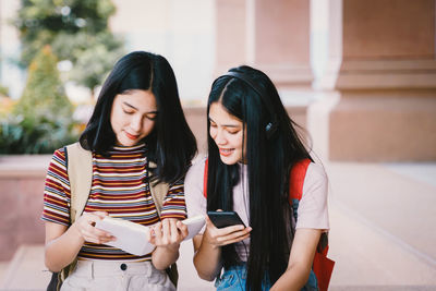 Young woman using mobile phone