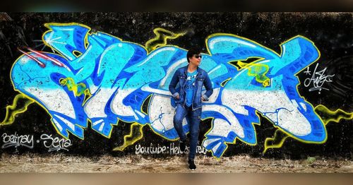 Graffiti on blue wall