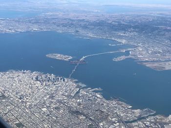 Aerial view of city by sea