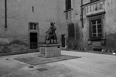 Statue in front of building