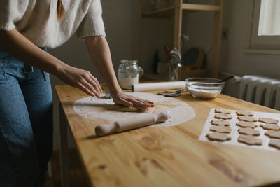 Young woman making christmas cookies