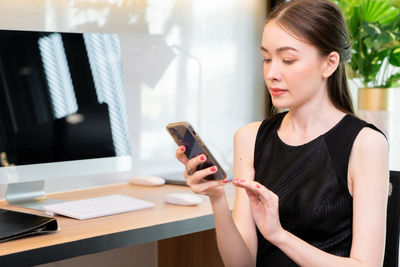 Young woman using mobile phone