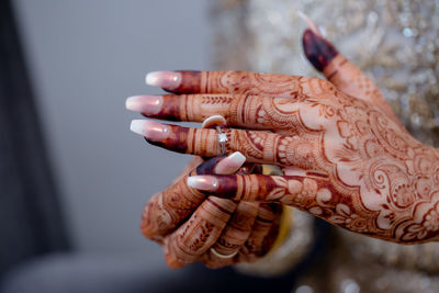 Close-up of woman hand with tattoo