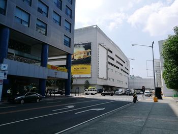 Road in city against sky