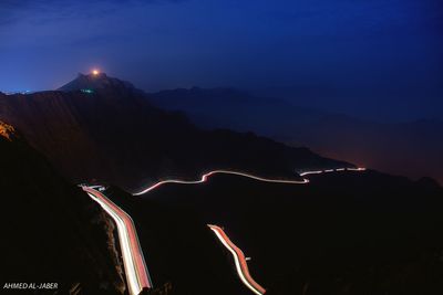 Light trails against sky at night