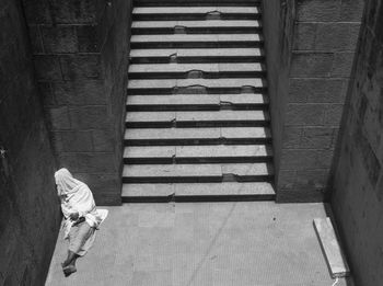 High angle view of man standing on staircase