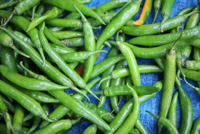 Full frame shot of green chili peppers for sale