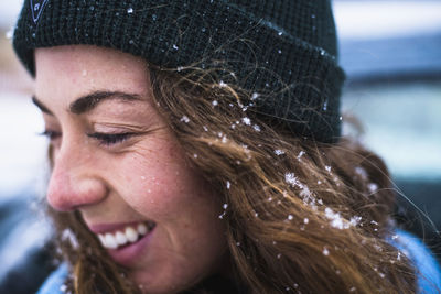 Woman face detail with snow in hair
