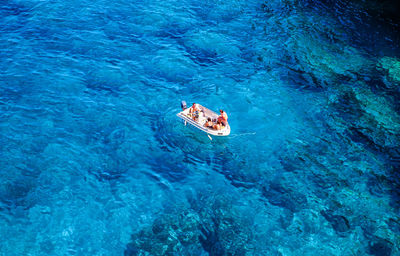 High angle view of people on sea shore