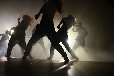 Silhouette dancers performing on stage