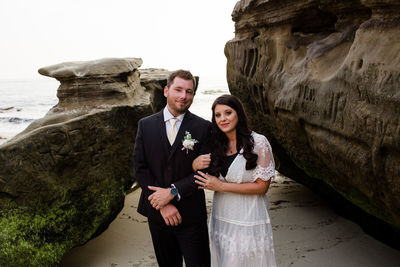 Young couple standing on rock