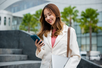 Young woman using mobile phone