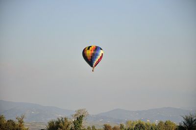 Low angle view of hot air balloon against clear sky