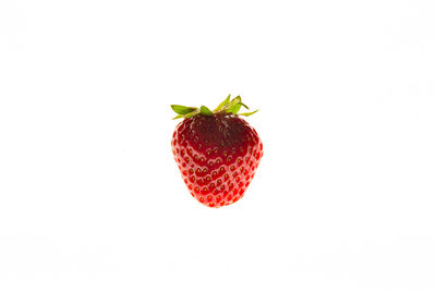 Close-up of strawberry over white background