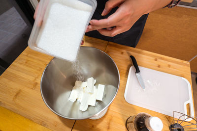 High angle view of person preparing food on table