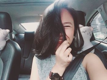 Portrait of woman sitting in car