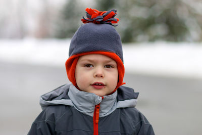 Portrait of boy in park during winter