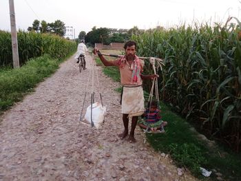 Full length of woman walking on field