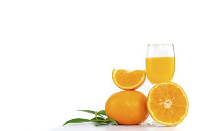 Orange fruit against white background