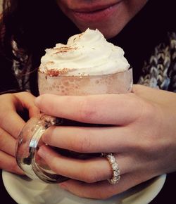 Close-up of hand holding ice cream
