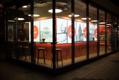 Illuminated city seen through glass