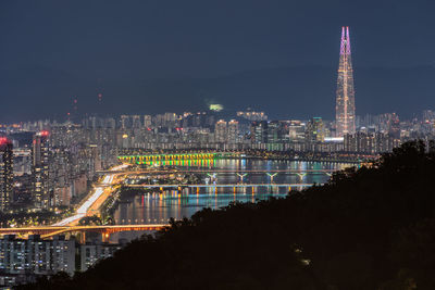 Illuminated buildings in city at night