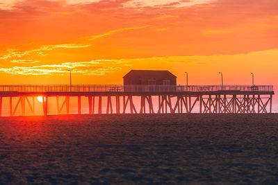 Scenic view of sea against orange sky