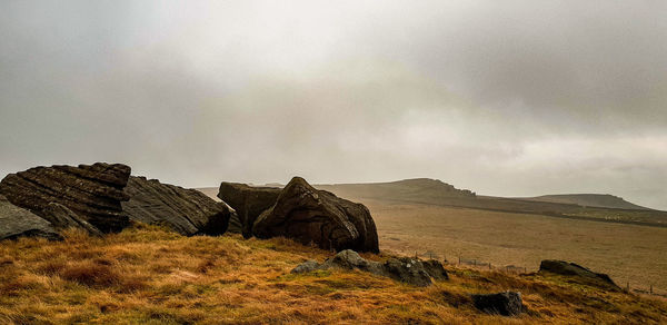 Rocks on land against sky