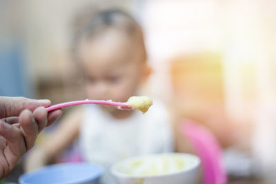 Midsection of woman eating food