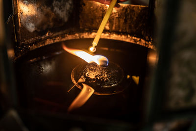 Close-up of lit tea light candles