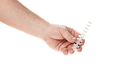 Close-up of woman hand against white background