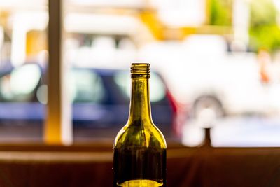 Close-up of glass bottle on table in restaurant