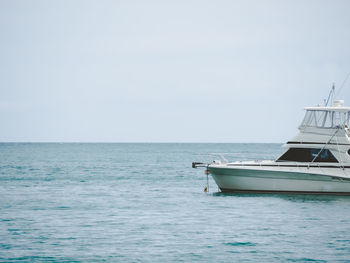 Boat sailing in sea against sky