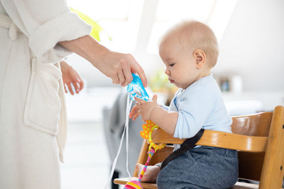 Portrait of cute girl playing with toys at home