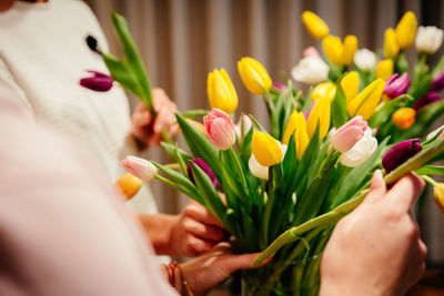 Close-up of woman holding bouquet of tulip