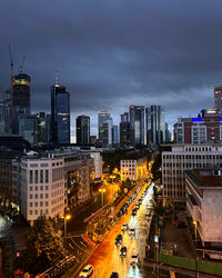 High angle view of illuminated buildings in city against sky