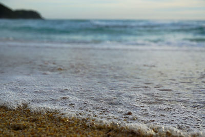 Surface level of beach against sky