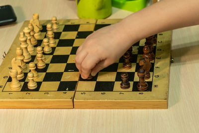 Low angle view of man playing on table