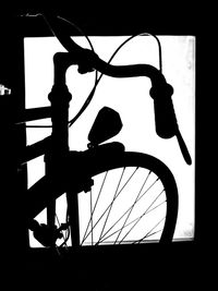 Silhouette of bicycle against sky