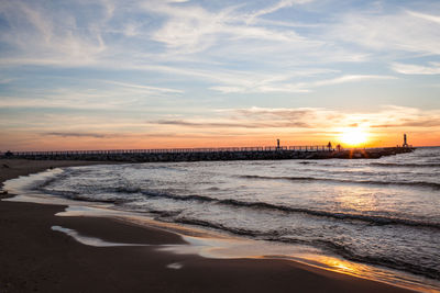 View of beach against sky during sunset