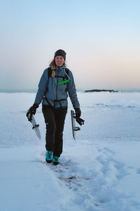 A woman returns from ice skating.