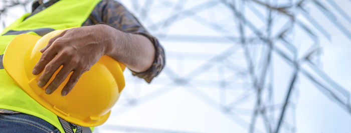 Close-up of man working at construction site