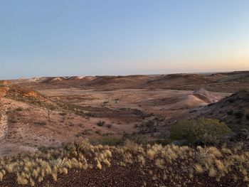 Scenic view of desert against clear sky