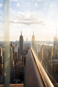 Usa, new york, new york city, midtown manhattan at sunset seen through window